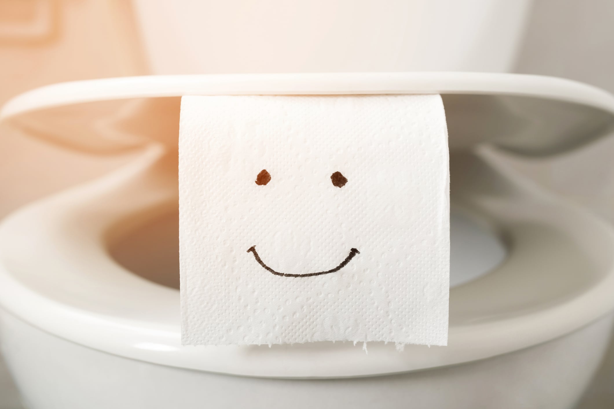Toilet paper  on the toilet bowl at home.