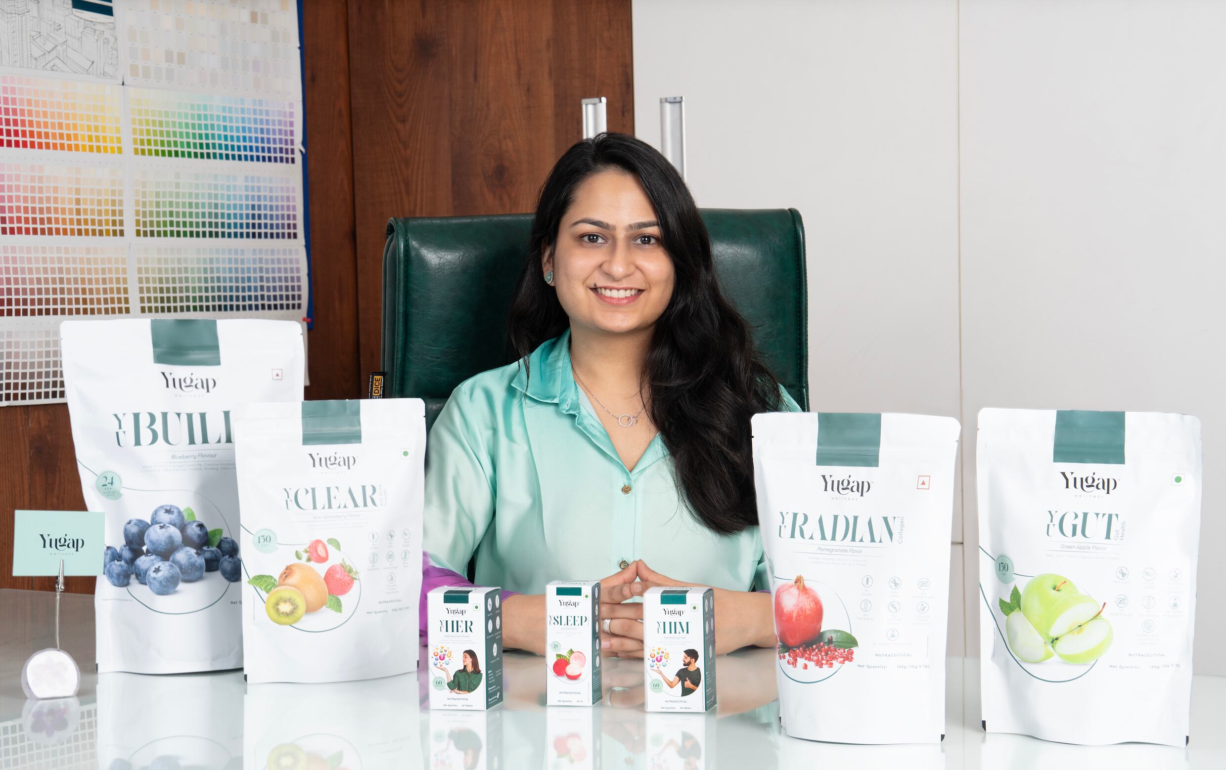 Yashna Garg, founder of YuGap Wellness, showcasing her company's range of nutraceutical products.