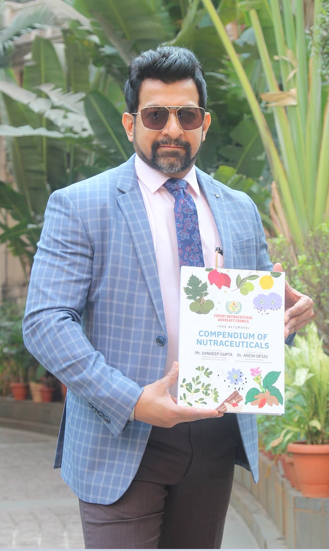 Sandeep-Gupta-with-his-book.png
