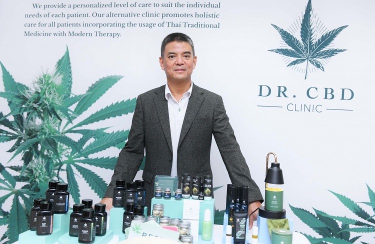 Pornchai Padmindra, CEO and founder of Dr. CBD showcasing his company's CBD products.  ©Dr. CBD