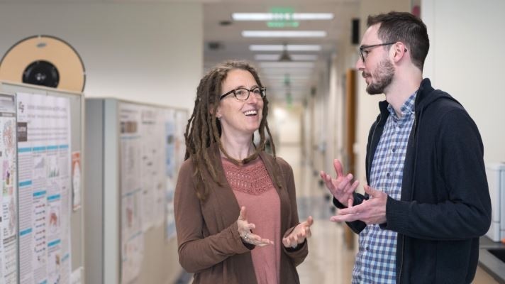 Katherine Pollard (left) and Patrick Bradley (right) identified genes that may help microbes live successfully in the human gut. [Photo: Elisabeth Fall]
